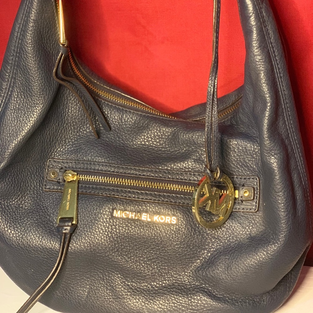 Navy blue purse with dust bag
